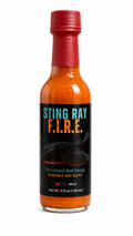Sting Ray F.I.R.E. gourmet hot sauce bottle with blood orange, bourbon, red jalapeño and Thai chili