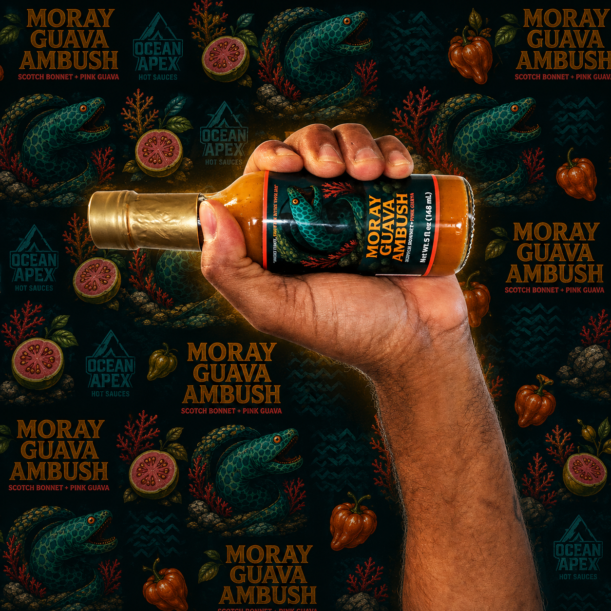 Hand holding Moray Guava Ambush hot sauce with pink guava, Scotch Bonnet peppers and moray eel artwork