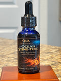 Ocean Sting-Ture Culinary Pepper Extract with Orange & Pineapple in a 1 fl oz blue glass dropper bottle.